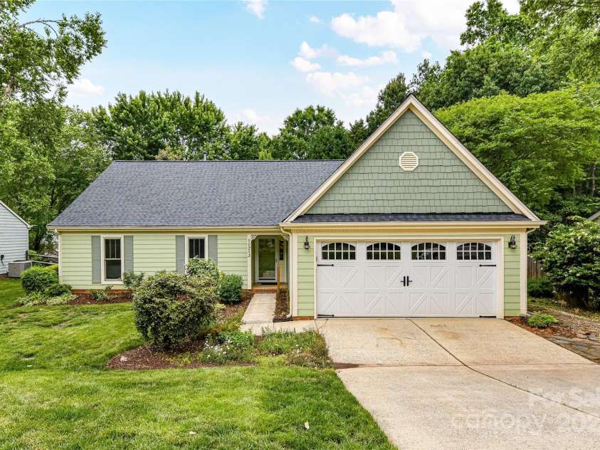 10213 Conistan Place, Cornelius, NC 28031.  MLS# CAR4223056, YatesRealty ID 26169. Two car, attached garage with epoxy floors and 4 custom floor to ceiling cabinets.