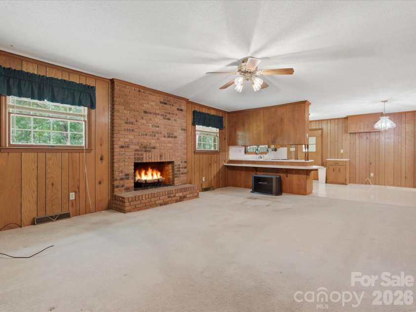 351 Highway 200 Highway, Stanfield, NC 28163.  MLS# CAR4380094, YatesRealty ID 26171. Fireplace - the fire is virtually staged - Seller has never used fireplace and makes no representation to its condition, Fireplace condition sold AS IS.