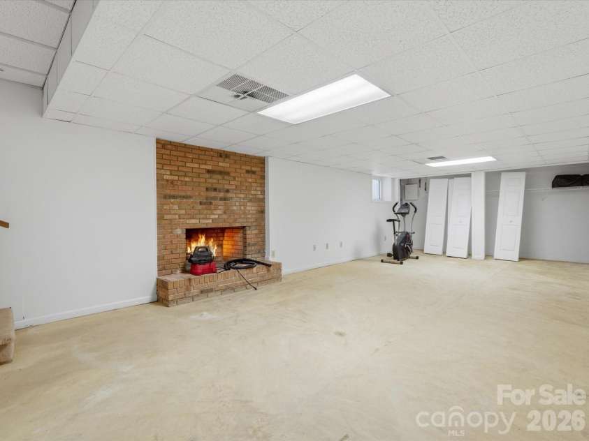 351 Highway 200 Highway, Stanfield, NC 28163.  MLS# CAR4380094, YatesRealty ID 26171. Fireplace - the fire is virtually staged - Seller has never used fireplace and makes no representation to its condition, Fireplace condition sold AS IS. Flooring has been removed in basement- seller will not replac