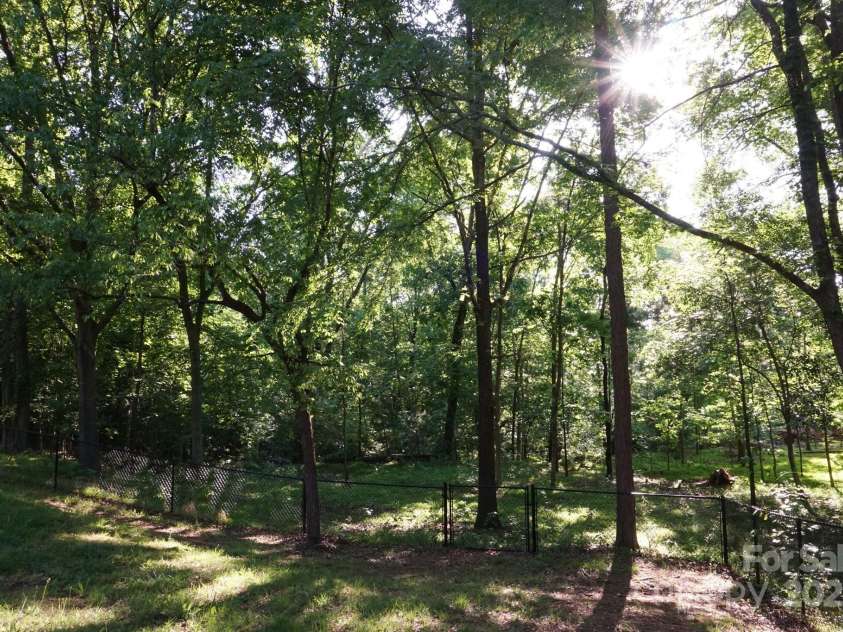 854 Silver Fox Drive, Concord, NC 28025.  MLS# CAR4251256, YatesRealty ID 26171. A backyard to enjoy year-round Can you hear the birds?