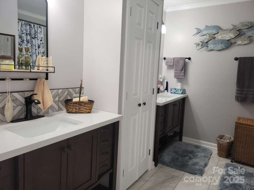 854 Silver Fox Drive, Concord, NC 28025.  MLS# CAR4251256, YatesRealty ID 26171. Primary bath #1. Two 42-inch  vanities!