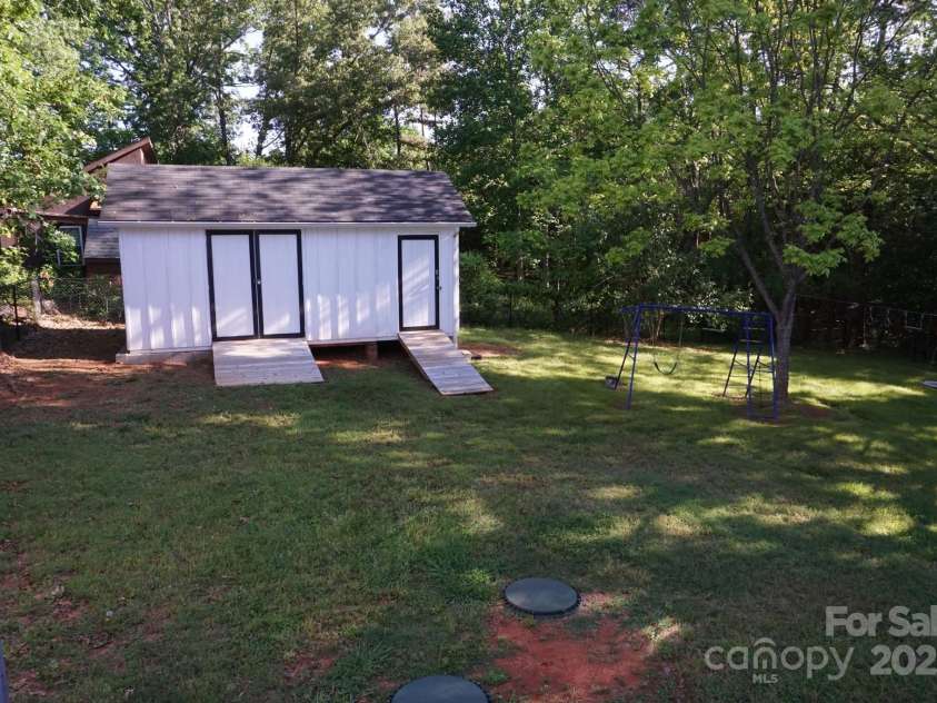 854 Silver Fox Drive, Concord, NC 28025.  MLS# CAR4251256, YatesRealty ID 26171. Workshop and storage both with electricity.