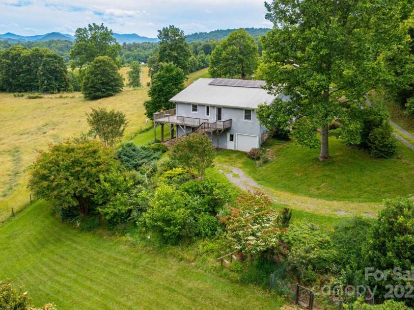 1510 Graham Road, Marshall, NC 28753.  MLS# CAR4241264, YatesRealty ID 26172. Lush Greenery surrounds the house