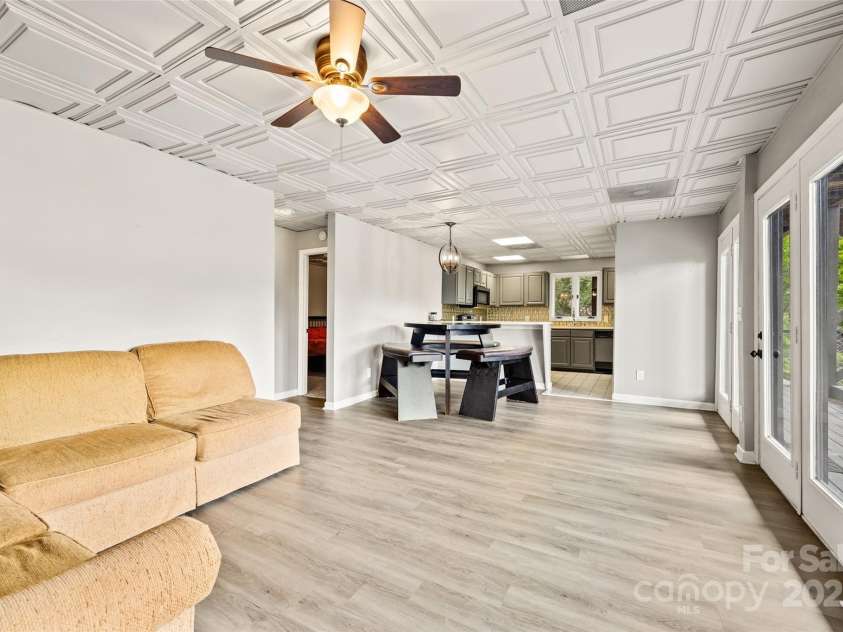 8014 Kiwi Point, Tega Cay, SC 29708.  MLS# CAR4234581, YatesRealty ID 26177. This charming 2-bedroom, 1.5-bathroom home offers a comfortable and convenient living space with the added bonus of a second living quarters. It is the perfect guesthouse for visitors who want short or extended stays!