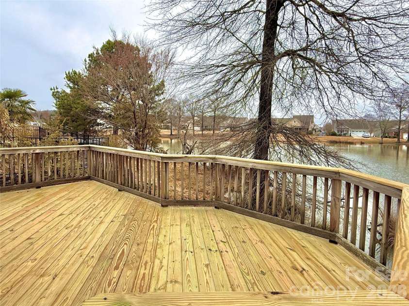5227 Crystal Lakes Drive, Rock Hill, SC 29732.  MLS# CAR4338532, YatesRealty ID 26181. Back Deck with Pond View