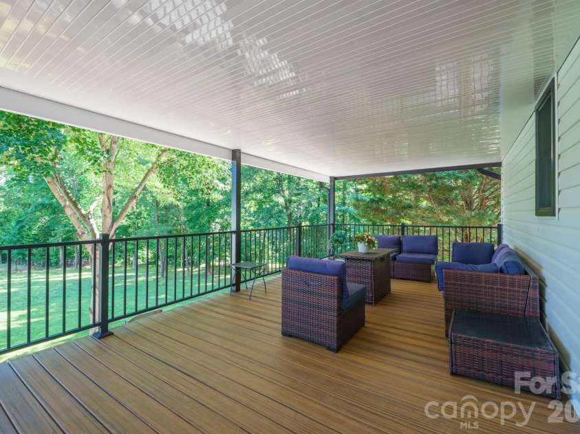 2549 Lake Shore Road, Denver, NC 28037.  MLS# CAR4385563, YatesRealty ID 26196. Covered deck off kitchen, dining, living area