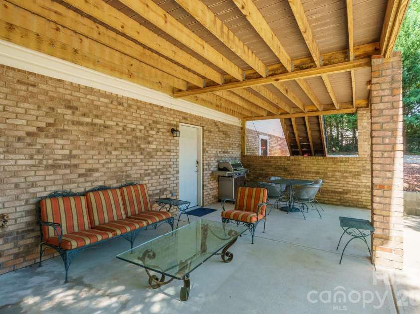 2549 Lake Shore Road, Denver, NC 28037.  MLS# CAR4385563, YatesRealty ID 26196. Under deck covered patio
