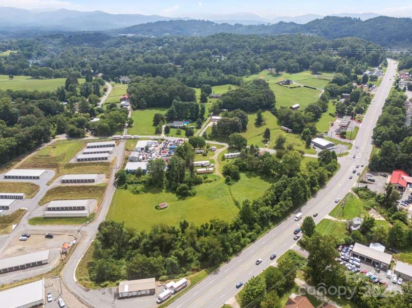 0000 New Leicester Highway, Asheville, NC 28806.  MLS# CAR3603724, YatesRealty ID 262. Busy 5-lane Hwy with plentiful newer apartment homes