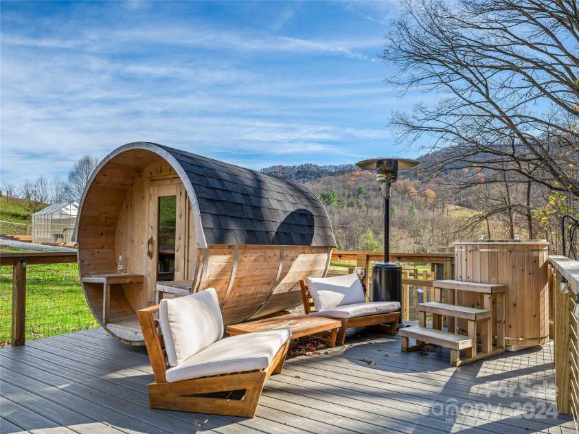 435 N Turkey Creek Road, Leicester, NC 28748.  MLS# CAR4199119, YatesRealty ID 262. Barrel sauna and cold plunge behind the main house/gardens; sits next to the creek!