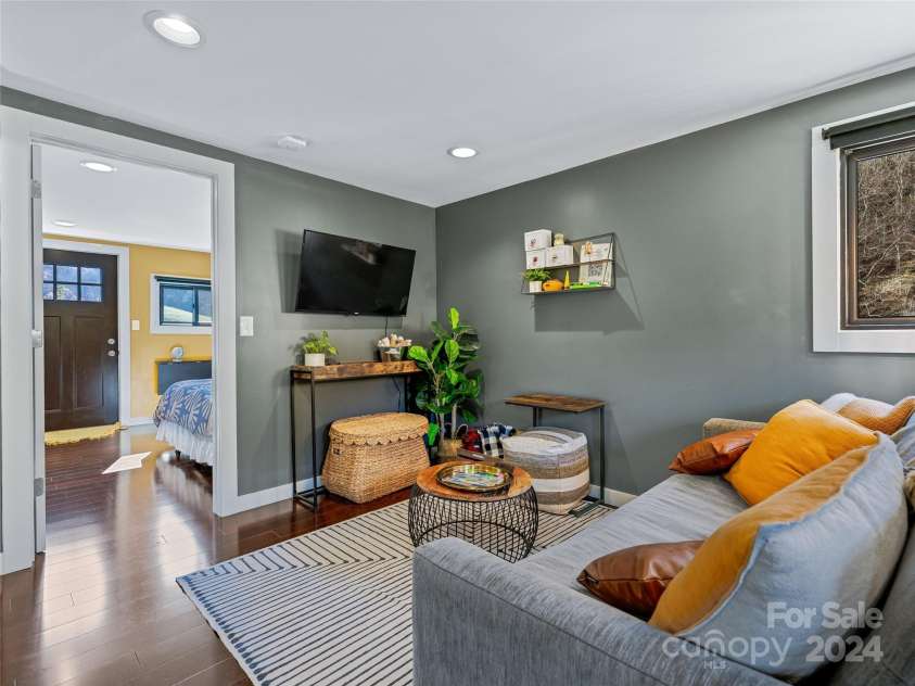 435 N Turkey Creek Road, Leicester, NC 28748.  MLS# CAR4199119, YatesRealty ID 262. Cozy living room/carriage house