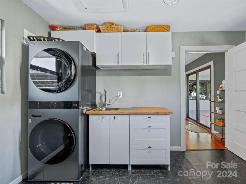 435 N Turkey Creek Road, Leicester, NC 28748.  MLS# CAR4199119, YatesRealty ID 262. Laundry room/main house