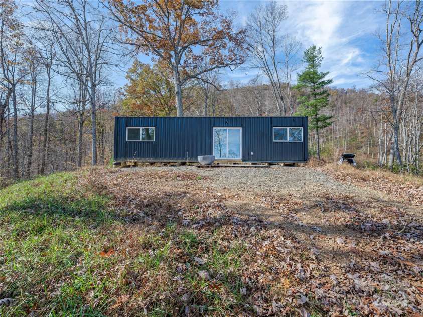 435 N Turkey Creek Road, Leicester, NC 28748.  MLS# CAR4199119, YatesRealty ID 262. Super cool, modern 1BR/1BA container home ready to be connected and serve as a rental or get-away