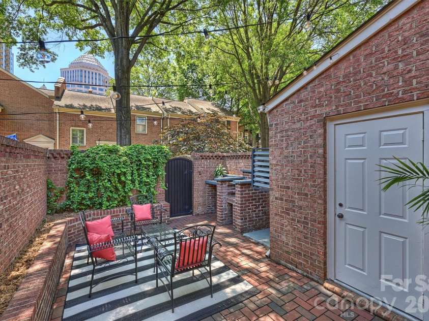 520 Poplar Street, Charlotte, NC 28202.  MLS# CAR4375281, YatesRealty ID 26207. Private brick courtyard with storage area