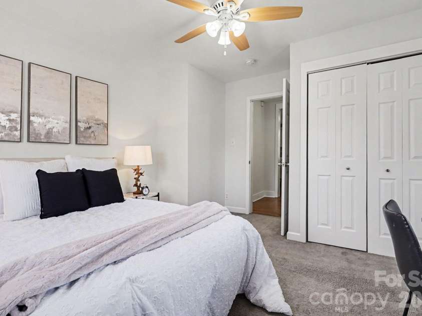 28 2nd Street, Cramerton, NC 28032.  MLS# CAR4357409, YatesRealty ID 26217. Oversize bedroom #2 featuring natural light and ceiling fan.