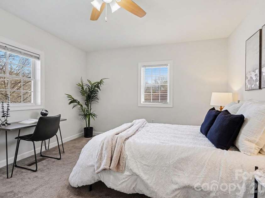 28 2nd Street, Cramerton, NC 28032.  MLS# CAR4357409, YatesRealty ID 26217. Oversize secondary bedroom featuring natural light and ceiling fan.