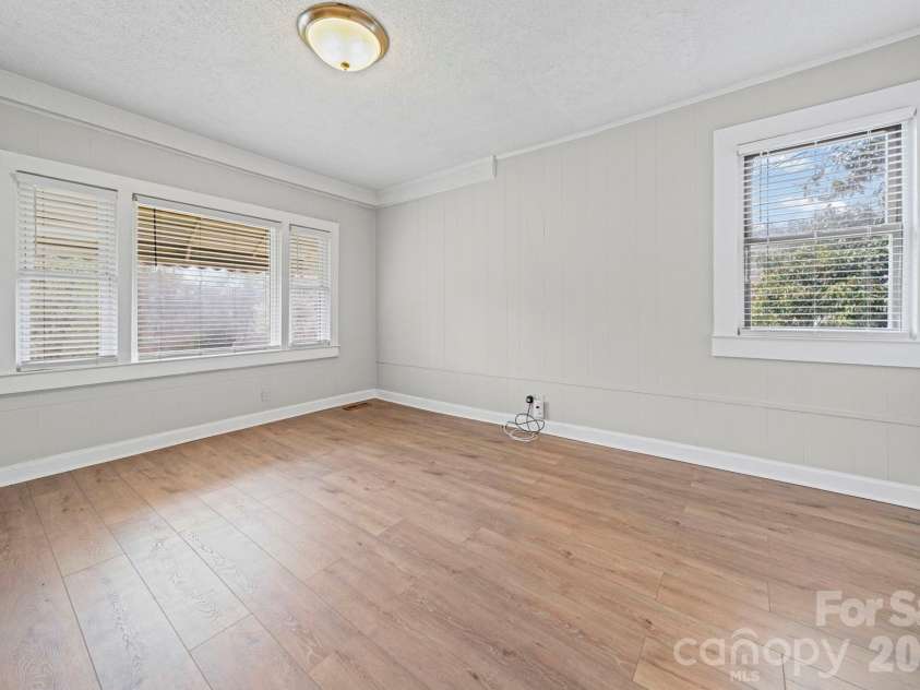 1866 Hilltop Circle, Gastonia, NC 28054.  MLS# CAR4355315, YatesRealty ID 26218. Living / dining room facing front