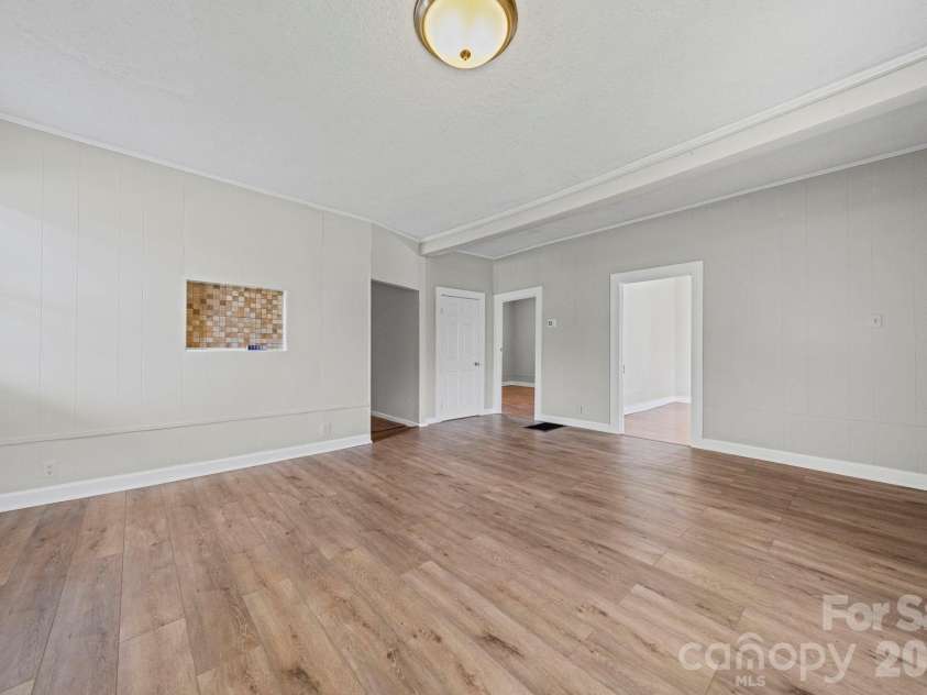 1866 Hilltop Circle, Gastonia, NC 28054.  MLS# CAR4355315, YatesRealty ID 26218. Living / dining room facing kitchen