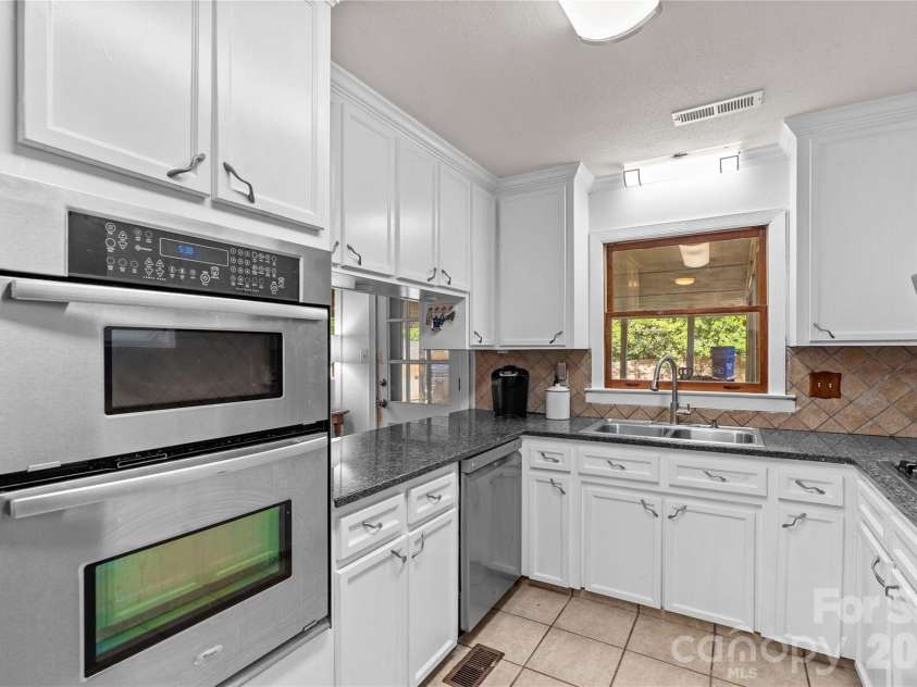 868 Fieldstone Road, Mooresville, NC 28115.  MLS# CAR4377553, YatesRealty ID 26226. Kitchen Overlooking Pool