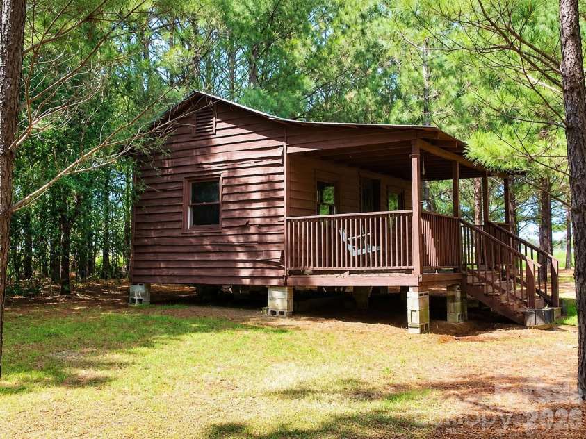5639 White Store Road, Wingate, NC 28174.  MLS# CAR4384824, YatesRealty ID 26238. Cabin