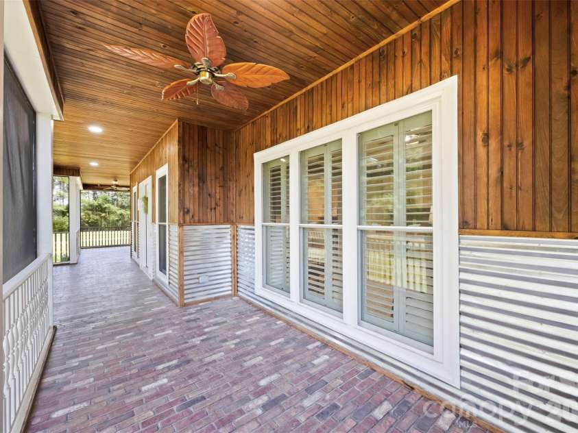 5639 White Store Road, Wingate, NC 28174.  MLS# CAR4384824, YatesRealty ID 26238. Screened Porch Pond Facing
