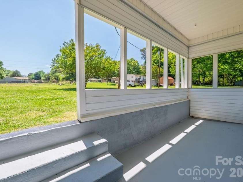 3407 Ratchford Drive, Gastonia, NC 28056.  MLS# CAR4385064, YatesRealty ID 26239. Covered Back Porch