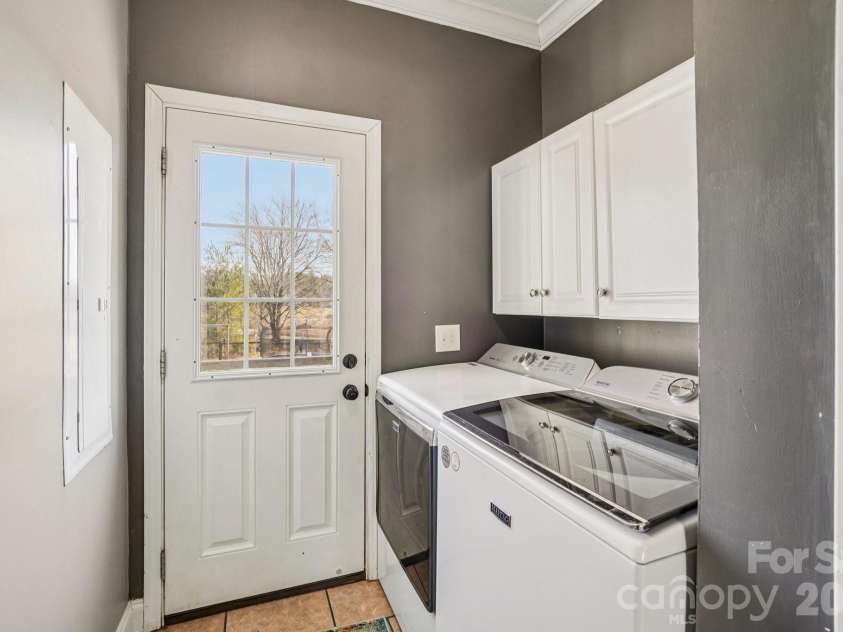76 Cheraw Lane, Flat Rock, NC 28731.  MLS# CAR4345207, YatesRealty ID 2624. Separate laundry room with outside access to back deck