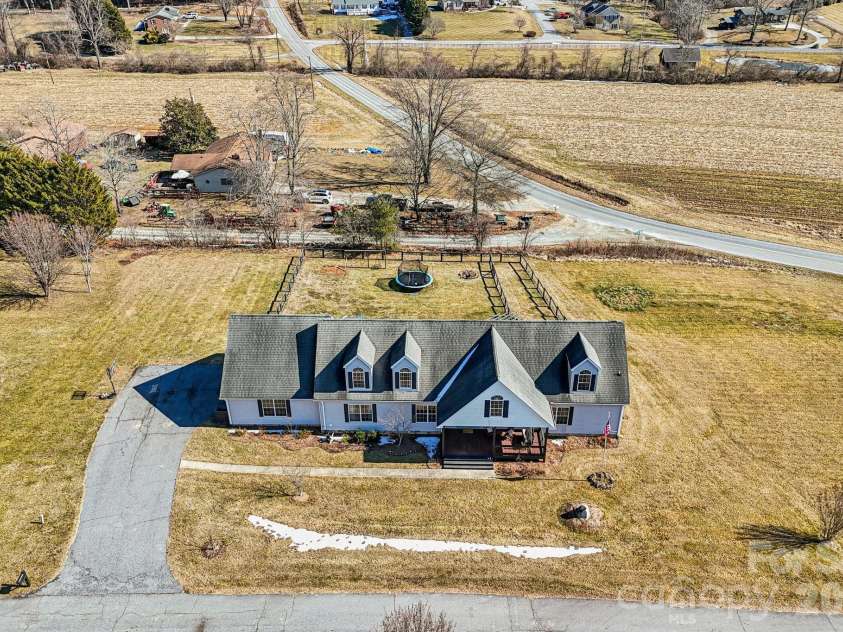 76 Cheraw Lane, Flat Rock, NC 28731.  MLS# CAR4345207, YatesRealty ID 2624. This home features an oversized garage with extra space for storage, tools, hobbies, or larger vehicles.
