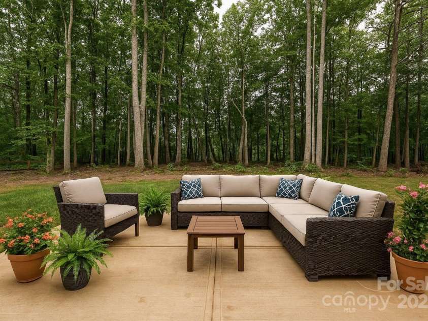 3020 Quiet Lane, Iron Station, NC 28080.  MLS# CAR4259783, YatesRealty ID 26247. Surrounded by Mature Trees and Nature. This patio is sure to be used very day. Enjoy your coffee while listeningn to natures soundrack.  Stargasze on a crisp fall evening...nothing but nature, a breeze and the sounds of