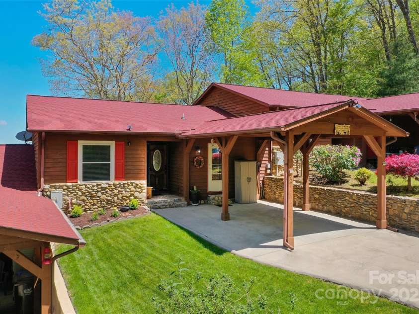 927 Henry Dingus Way, Maggie Valley, NC 28751.  MLS# CAR4252374, YatesRealty ID 26250. Front of home and carport