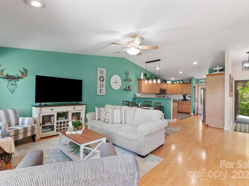 927 Henry Dingus Way, Maggie Valley, NC 28751.  MLS# CAR4252374, YatesRealty ID 26250. Great room looking toward kitchen and main front door entrance