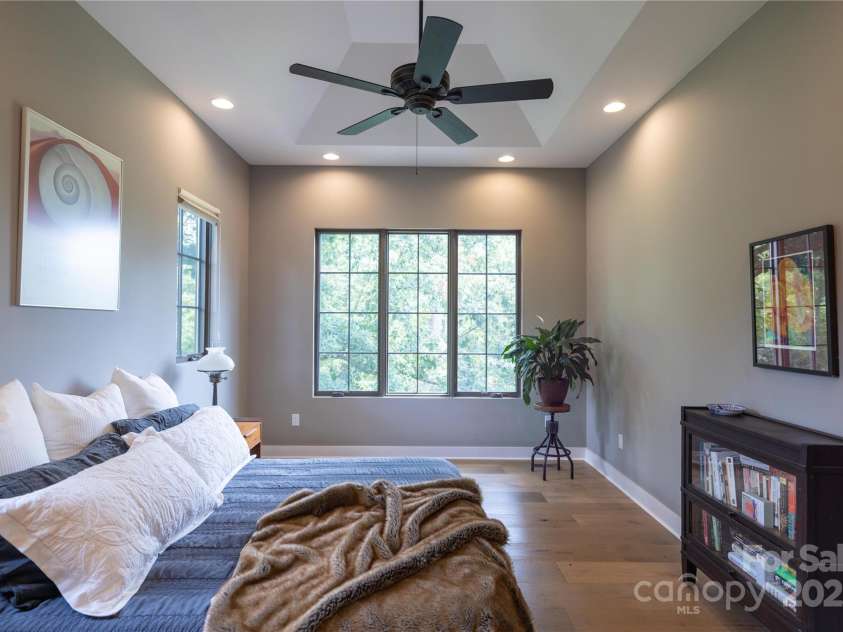 65 Wandering Oaks Way, Asheville, NC 28805.  MLS# CAR4267136, YatesRealty ID 26255. Main level primary bedroom