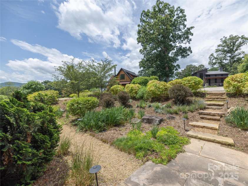 65 Wandering Oaks Way, Asheville, NC 28805.  MLS# CAR4267136, YatesRealty ID 26255. Mature landscaping with blueberries!