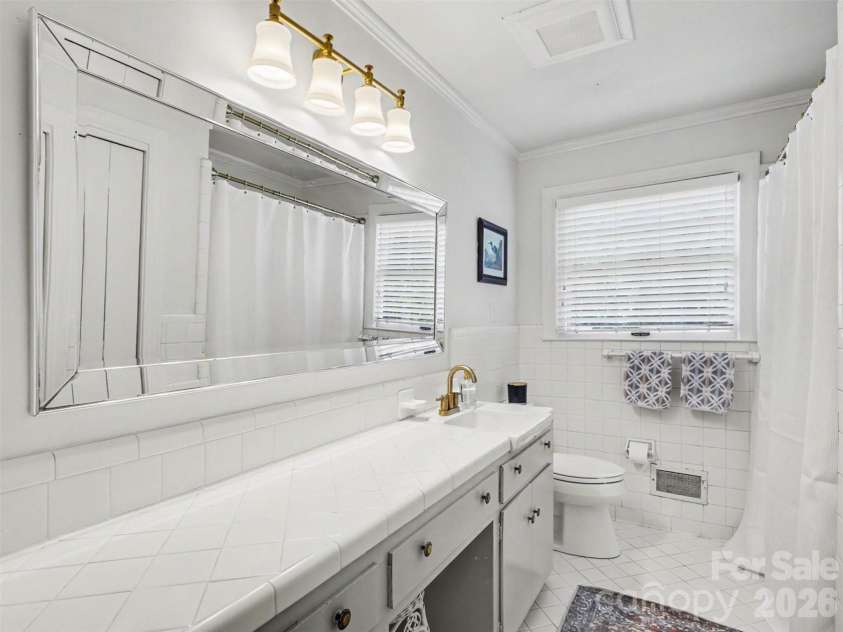 441 Claymont Street, Concord, NC 28025.  MLS# CAR4381482, YatesRealty ID 26271. A hall bath with all its original charm intact