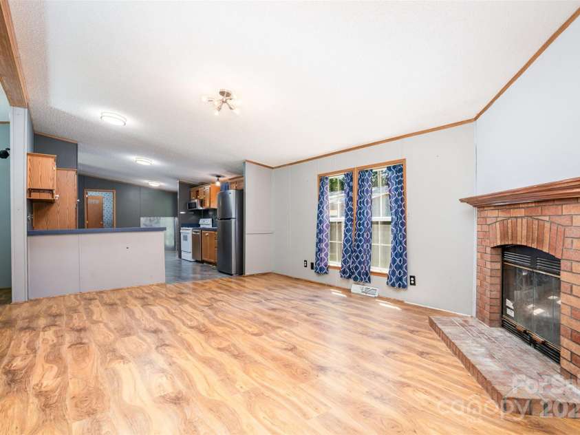495 Brumley Road, Mooresville, NC 28115.  MLS# CAR4272935, YatesRealty ID 26284. 2nd living area into kitchen