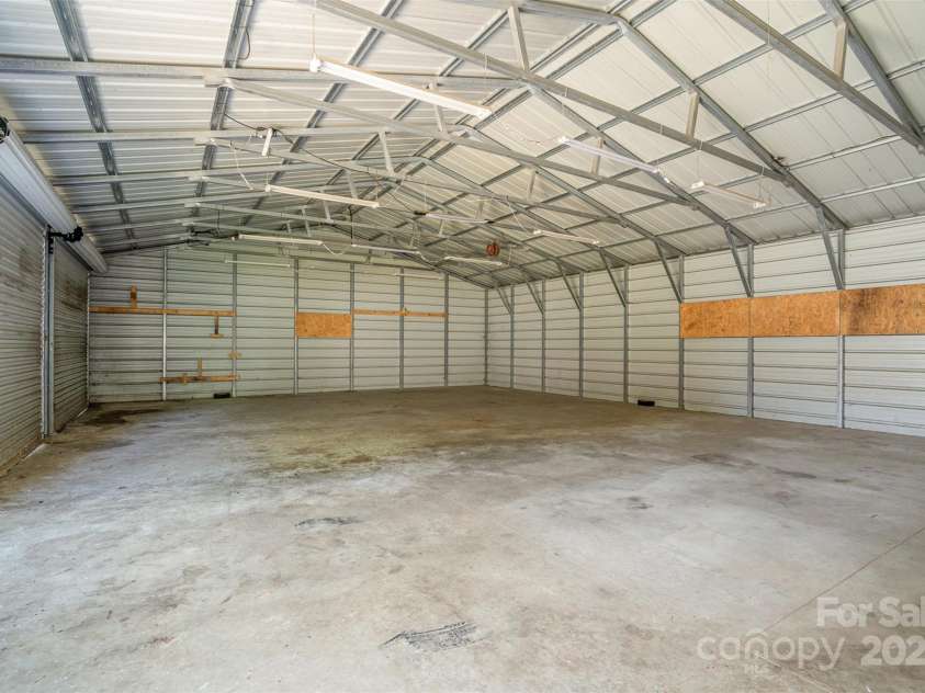 495 Brumley Road, Mooresville, NC 28115.  MLS# CAR4272935, YatesRealty ID 26284. 3.5 Car Garage last stall will hold 21' Boat Trailer