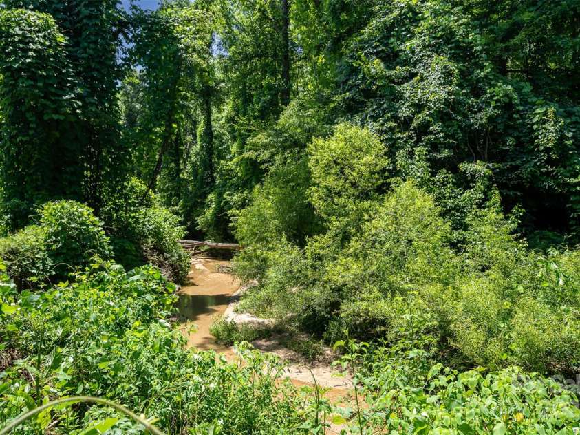 495 Brumley Road, Mooresville, NC 28115.  MLS# CAR4272935, YatesRealty ID 26284. Creek Running property Line