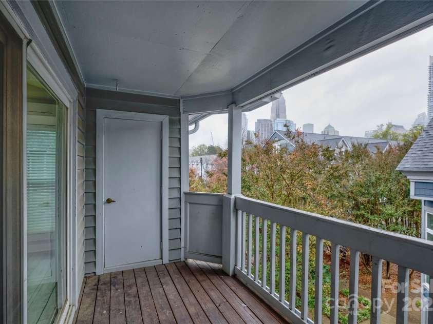 525 Graham Street, Charlotte, NC 28202.  MLS# CAR4321780, YatesRealty ID 2629. Spacious back patio with two storage units