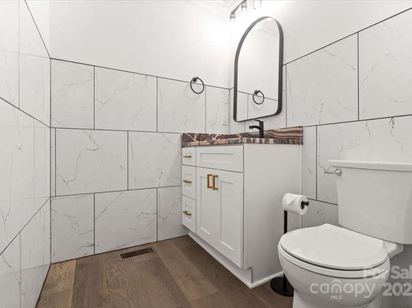 9830 Spring Harvest Drive, Mint Hill, NC 28227.  MLS# CAR4326082, YatesRealty ID 26292. Half bath on main