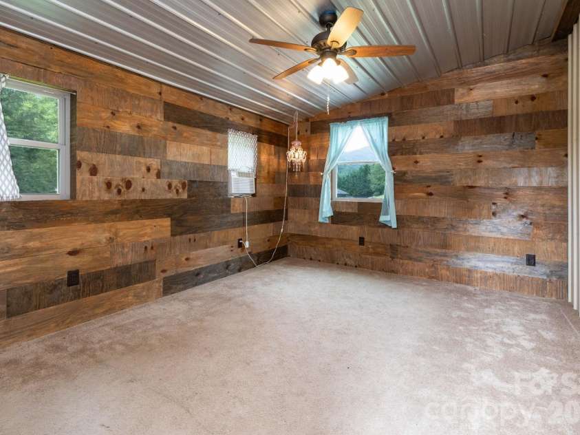 18 Hoye Lane, Candler, NC 28715.  MLS# CAR4345280, YatesRealty ID 26294. She Shed/Office attached to separate garage