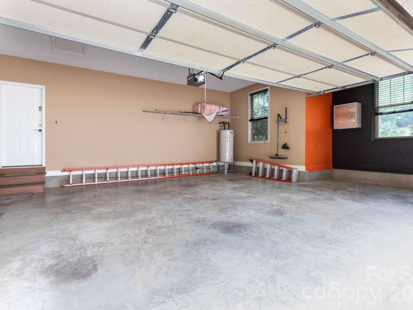 18 Hoye Lane, Candler, NC 28715.  MLS# CAR4345280, YatesRealty ID 26294. Two-car attached garage