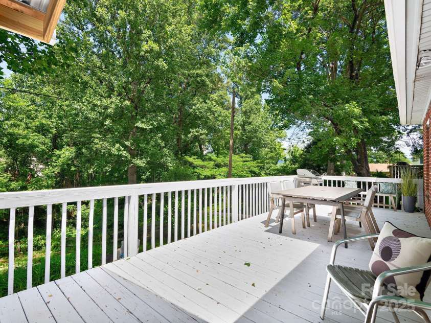 5 Enka Oak Street, Candler, NC 28715.  MLS# CAR4257341, YatesRealty ID 26299. Spacious and inviting back patio with ample space to gather overlooking the back yard