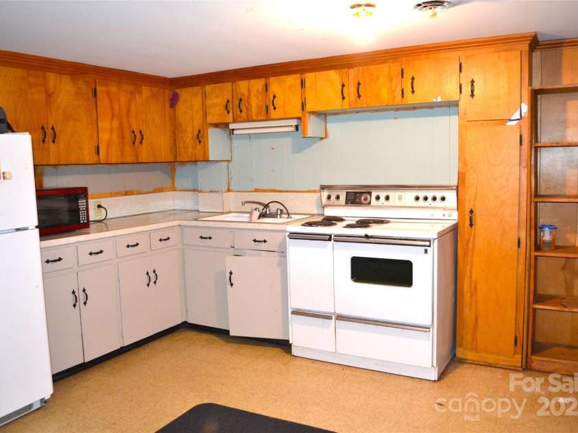 405 Wesley Heights Drive, Albemarle, NC 28001.  MLS# CAR4272842, YatesRealty ID 263. Basement kitchen