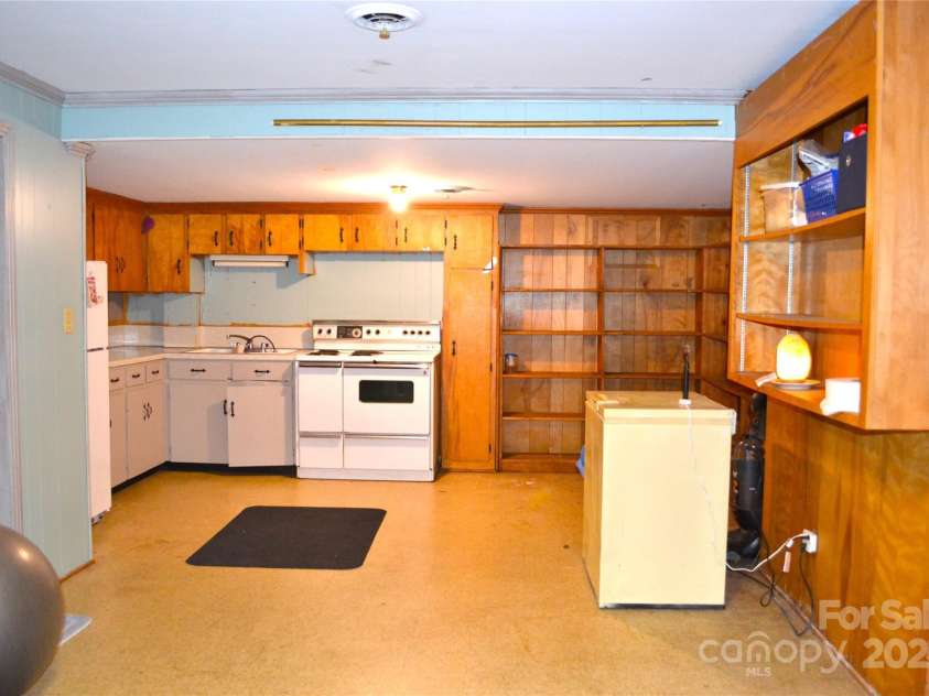 405 Wesley Heights Drive, Albemarle, NC 28001.  MLS# CAR4272842, YatesRealty ID 263. Basement living and Kitchen area