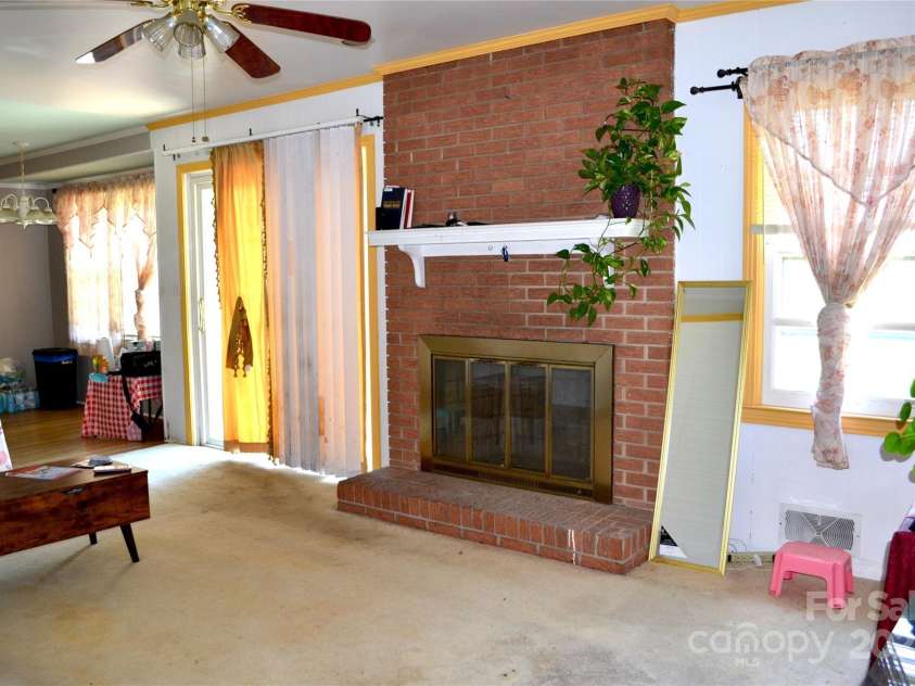 405 Wesley Heights Drive, Albemarle, NC 28001.  MLS# CAR4272842, YatesRealty ID 263. Family room fireplace