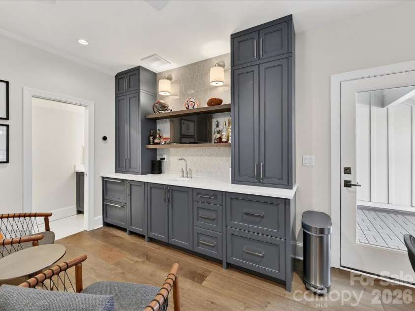 3074 Selwyn Avenue, Charlotte, NC 28209.  MLS# CAR4366300, YatesRealty ID 26301. Custom bar with refrigerator drawers, ice make and sink