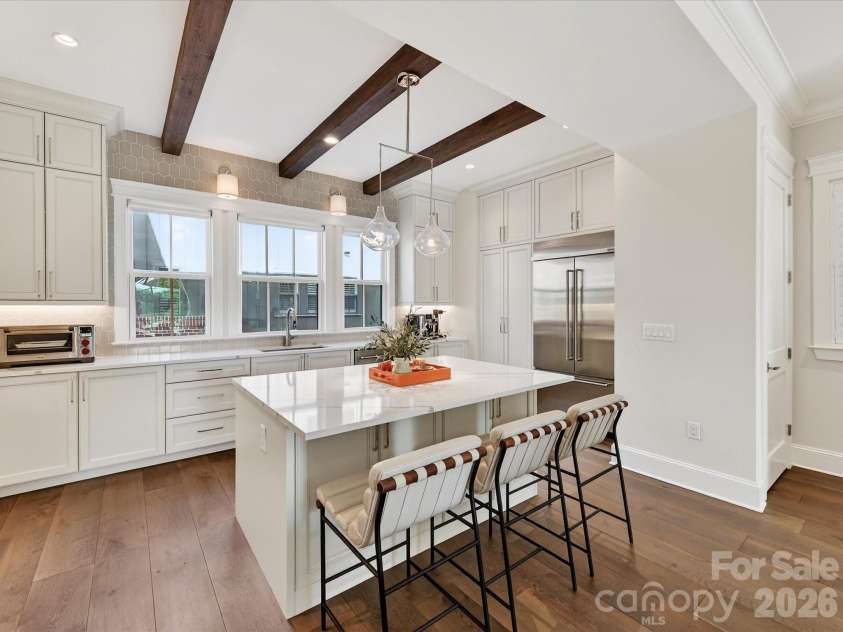 3074 Selwyn Avenue, Charlotte, NC 28209.  MLS# CAR4366300, YatesRealty ID 26301. Main level Kitchen with wood beams