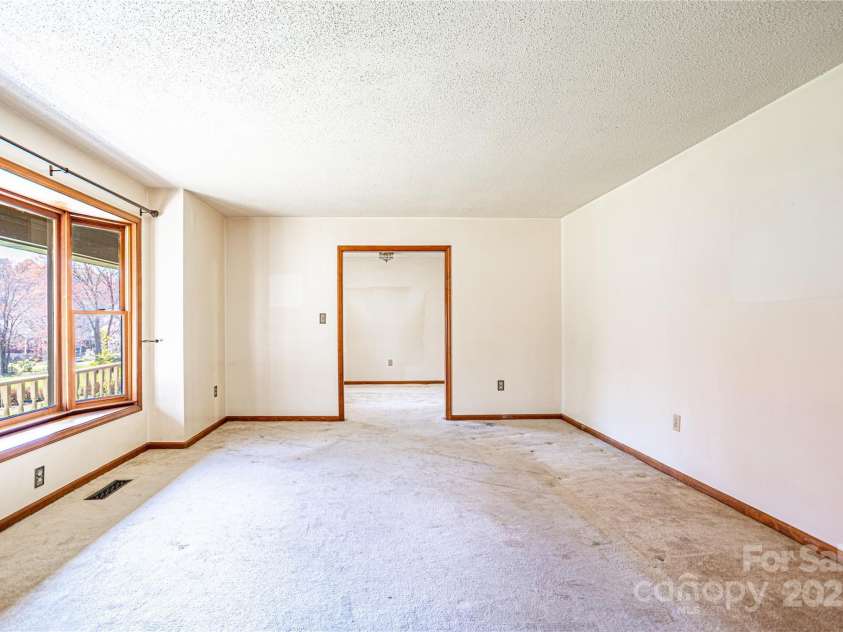 35 Tree Top Drive, Arden, NC 28704.  MLS# CAR4237850, YatesRealty ID 26306. Living Room off Dining Room