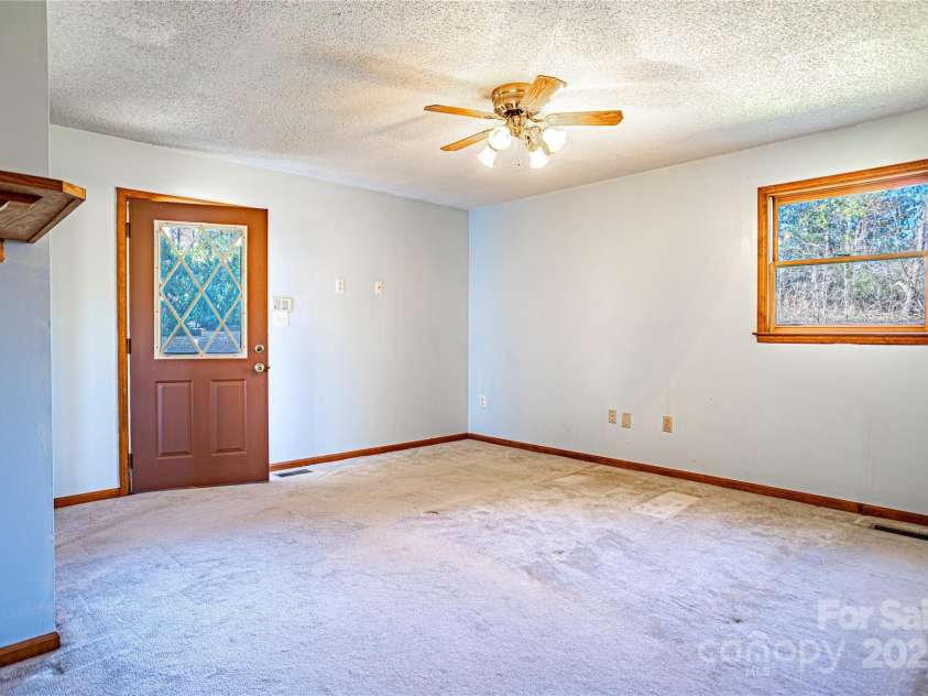 35 Tree Top Drive, Arden, NC 28704.  MLS# CAR4237850, YatesRealty ID 26306. Primary bedroom with entrance to back patio