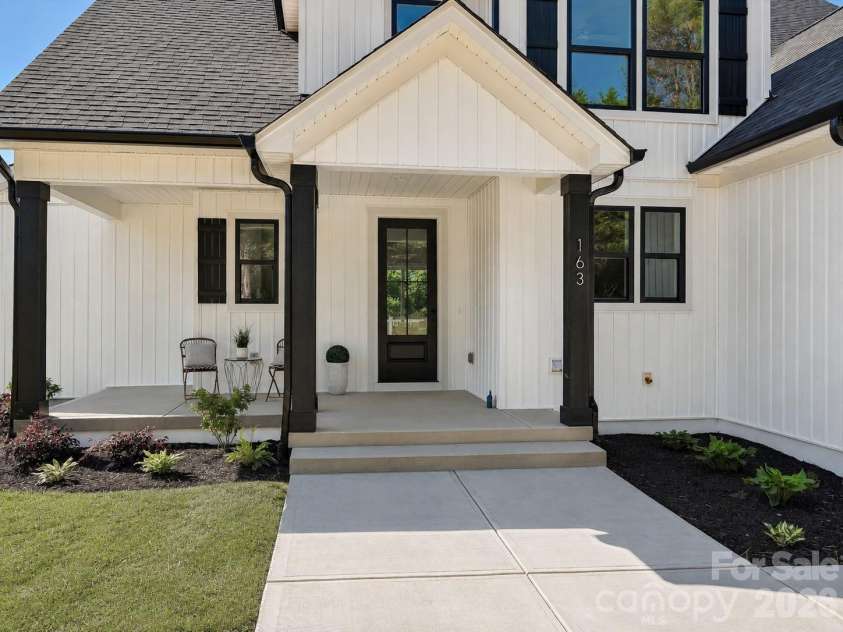 163 Lone Pine Road, Statesville, NC 28625.  MLS# CAR4383652, YatesRealty ID 26311. Charming covered front porch creates a warm and inviting welcome home experience.