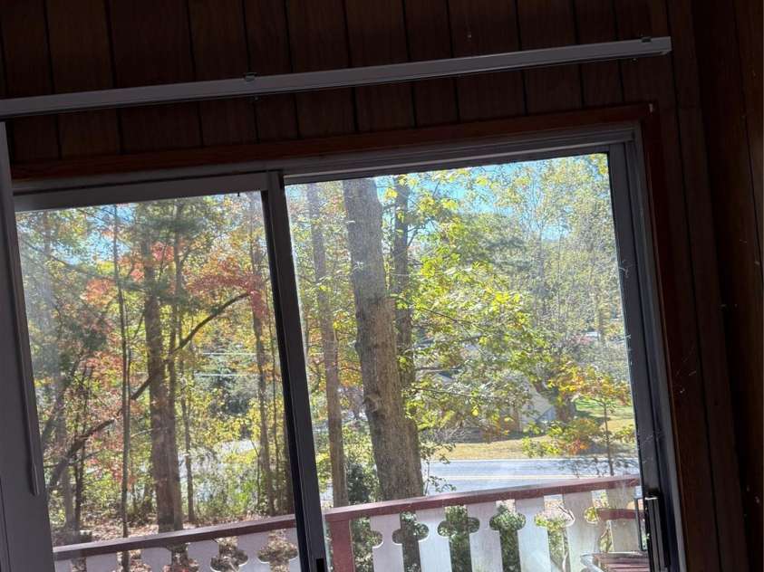 202 Lyndhurst Drive, Hendersonville, NC 28791.  MLS# CAR4315810, YatesRealty ID 2632. View from Living room Lyndhurst road.